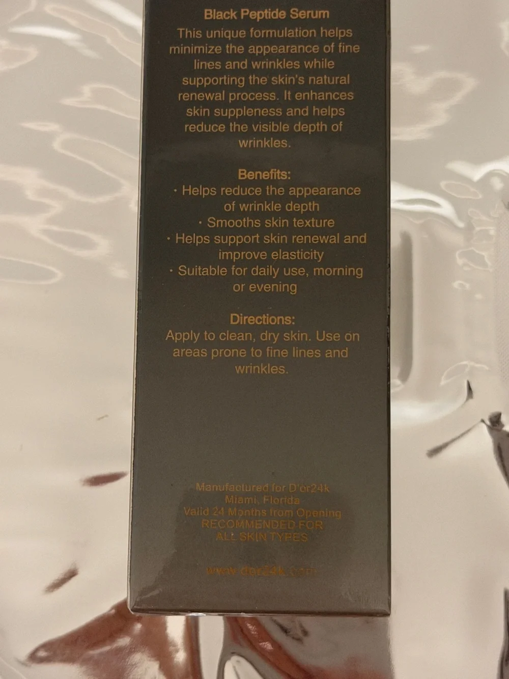 D'OR24K Prestige Black Multi Peptide Serum — Black & Gold